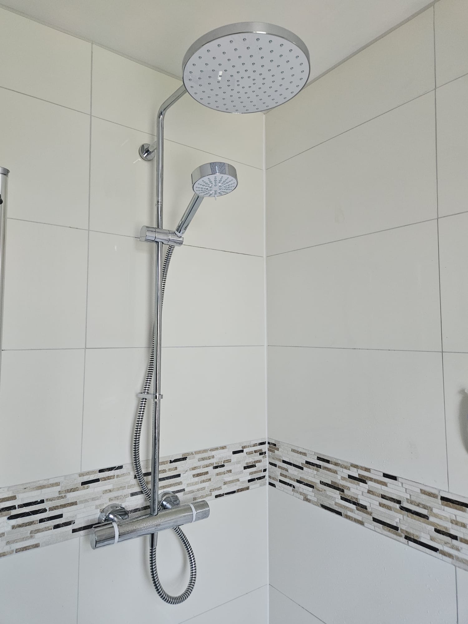 Shower after: new thermostatic bar with rain head and hand shower installed